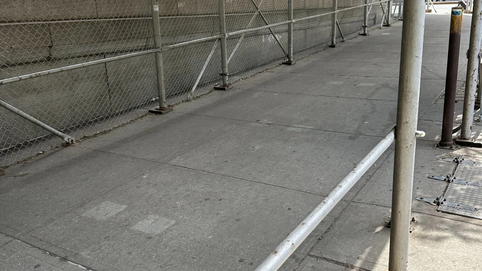 Heavy-duty sidewalk shed and pipe scaffolding on NYC facade project