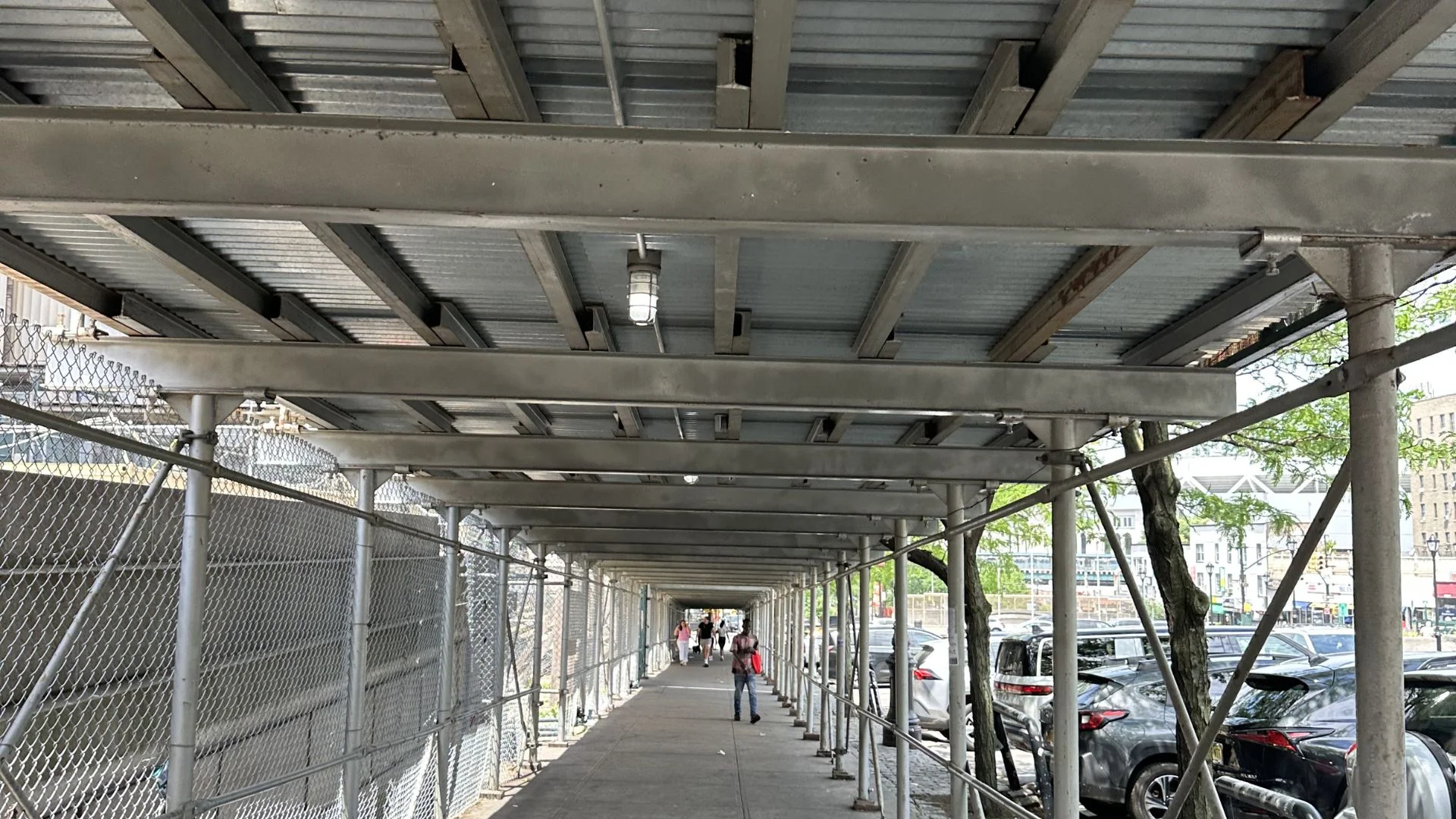 Heavy-duty sidewalk shed and pipe scaffolding on NYC facade project