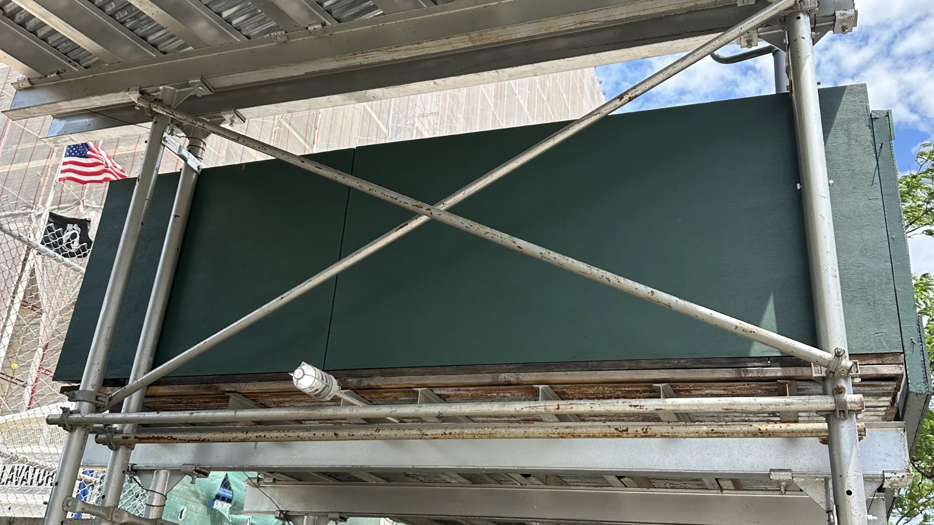 Completed sidewalk shed installation on NYC street corner